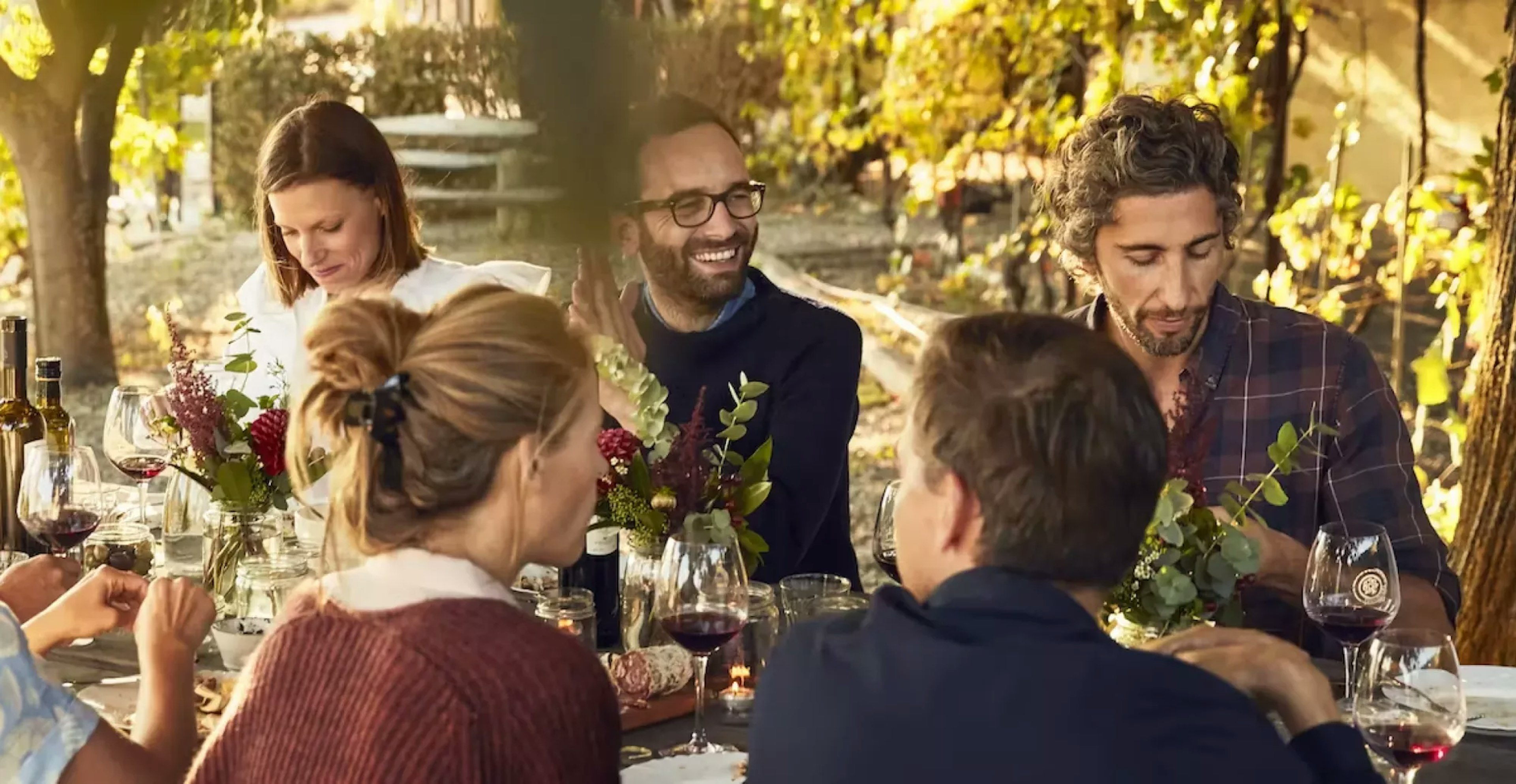 Group of people sharing a meal outdoors